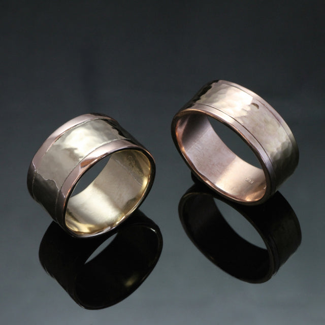 Two 14k gold wedding rings consisting of three bands. 10mm ring with hammered white gold in the center and smooth rose gold edges, the other ring is made with rose gold and is 9mm wide.