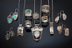 Selection of silver, gold or mokume earrings, pendants, rings, turquoise set into earrings and rings, moonstones, quartz