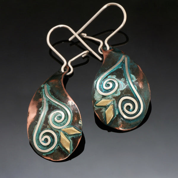 copper silver earrings with blue/green patina, silver spirals and brass accents.