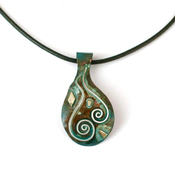 copper necklace with blue/green patina, silver spirals and brass accents on a leather band