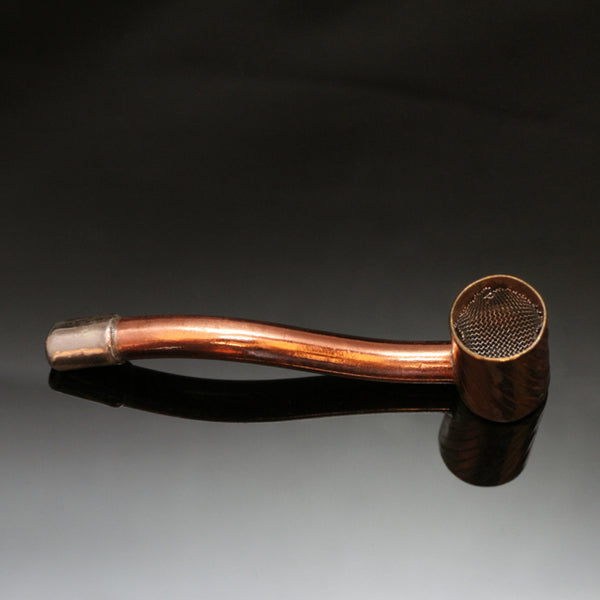Copper pipe with a screen inside a brass bowl and a silver mouthpiece.