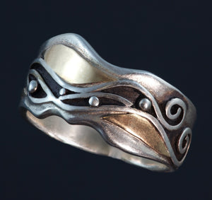 silver gold ring undulated edges 14k gold fitted around silver waves and spirals, black patina