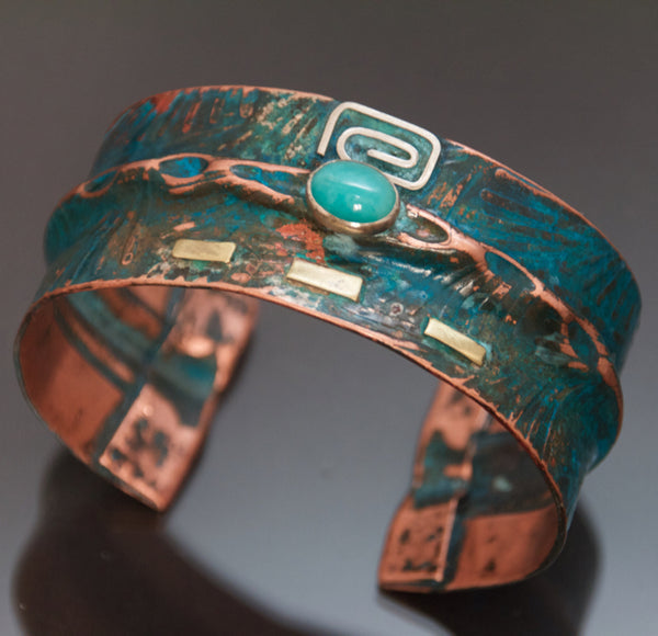 wide folded copper bracelet with embossed fern pattern, square silver and brass with blue-green patina and oval amazonite.