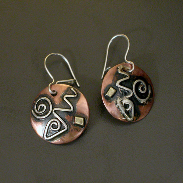 round copper earrings with silver spirals, brass and black patina