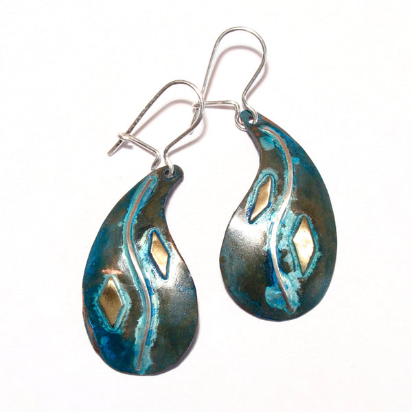 Teardrop shaped copper earring with a silver wave and blue/green patina