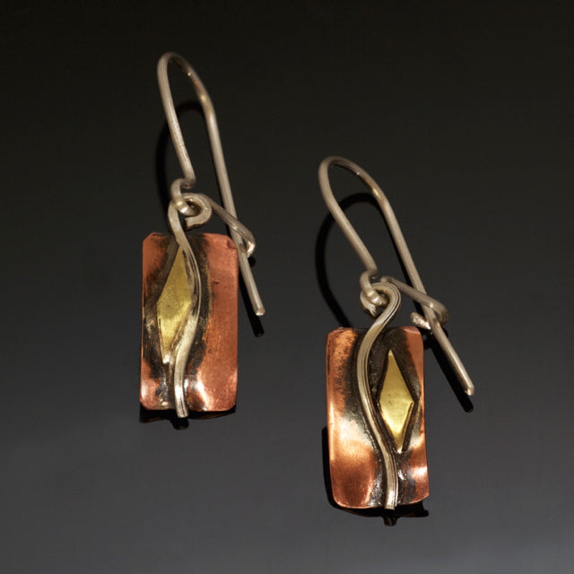 small rectangular copper earrings with a silver wave, brass and black patina