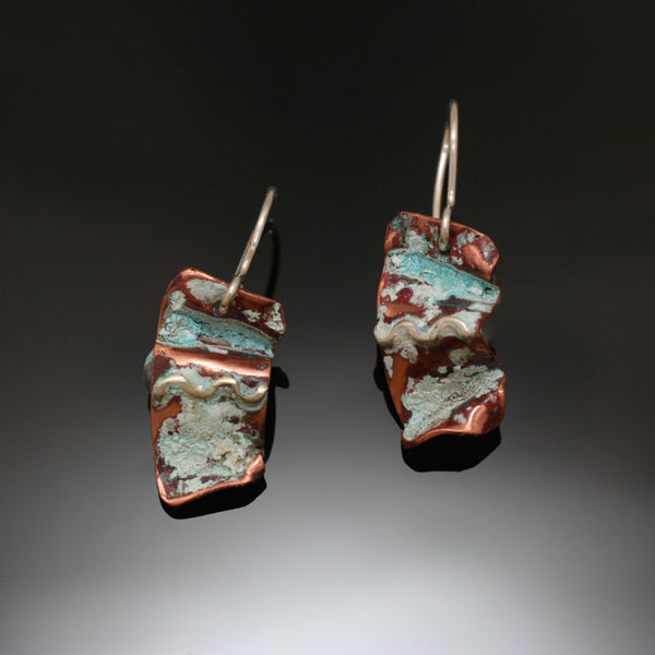 small folded copper earrings with silver, brass accents and antiqued patina