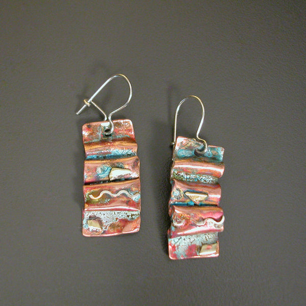 folded copper earrings with silver wave, brass accents and antiqued red blue patina