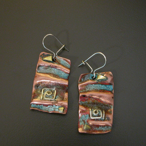 folded copper earrings with square silver spiral, brass accents and red green patina