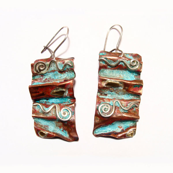 Large folded copper earrings with 2 silver spiral waves, brass accents and red green patina