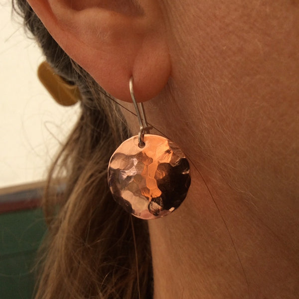 round shiny hammered copper earrings on silver hooks