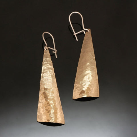 shiny hammered brass earrings in a triangular shape