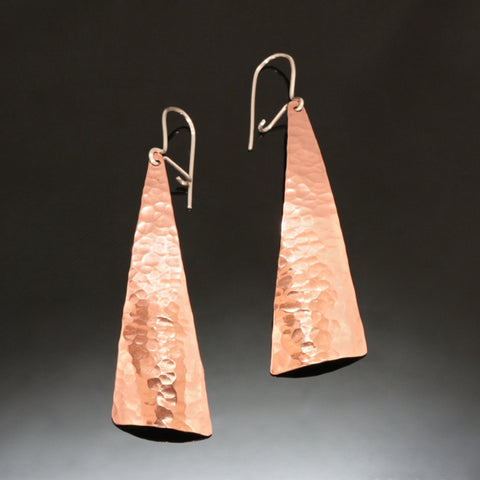 shiny hammered copper earrings in a triangular shape