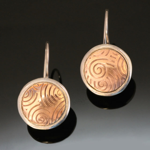 round silver earrings with inlayed 14k gold fill embossed with spirals