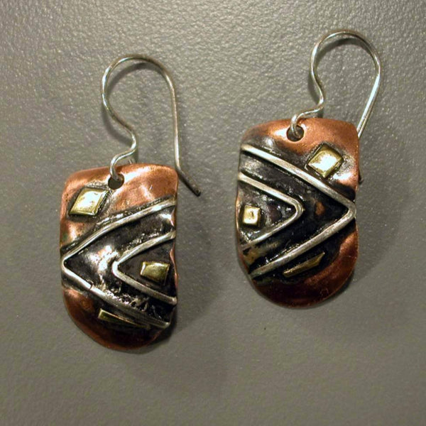 half round copper earrings with triangles and brass accents black patina.