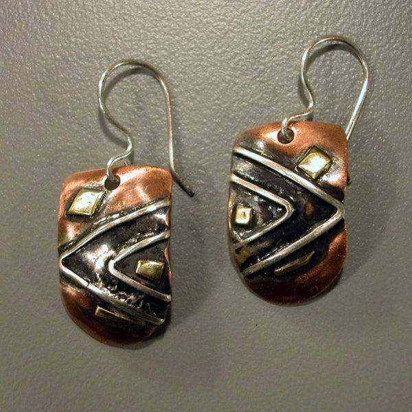 half round copper earrings with triangles and brass accents black patina
