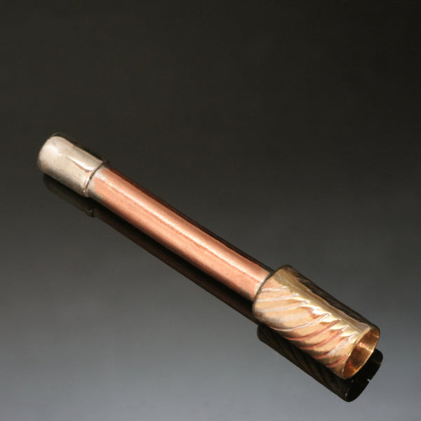 small straight pipe with copper stem and brass bowl embossed with a wave pattern.