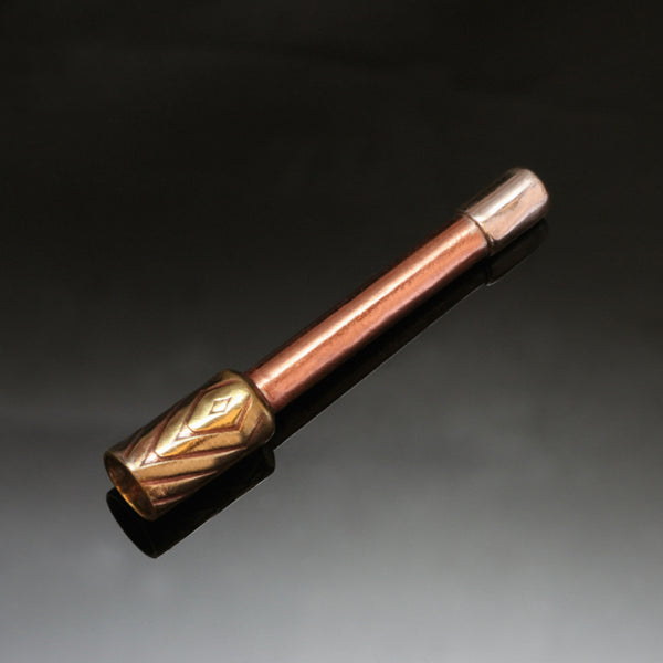 small straight pipe with copper stem and brass bowl embossed with a diamond pattern.