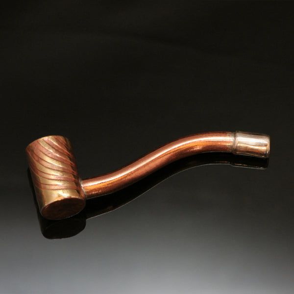 Traditionally shaped pipe with a narrow straight brass bowl, silver mouthpiece and a copper stem.