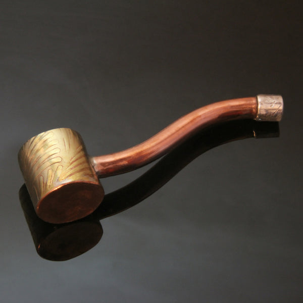 Traditionally shaped pipe with a straight edged brass bowl, silver mouthpiece and a copper stem.