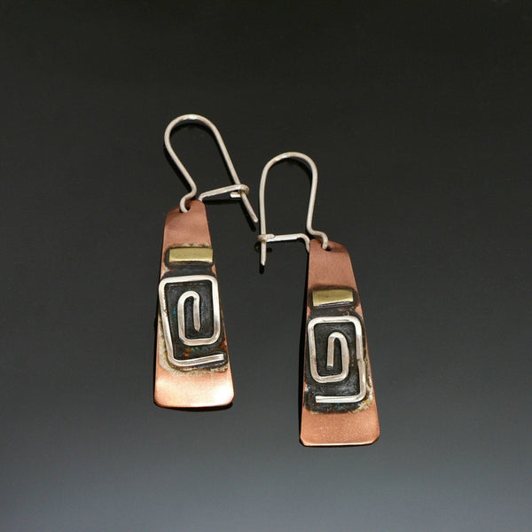 long copper earrings with square silver spiral, brass and black patina